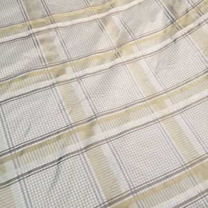 100% Silk taffeta stripe mixed with plaid with little shine on it usable for apparel, accessories and interior designing. 54&quot; wide.
