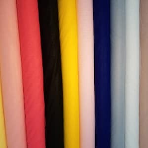 Super fine soft quality shiny tulle 60&quot; wide. Usable for apparel accessories and interior designing. Soft drapey and see thru exotic fabric