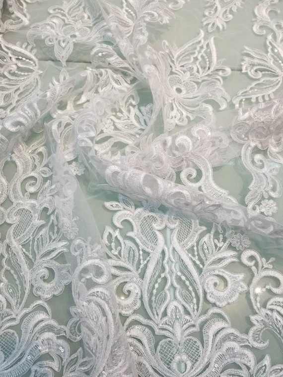 White color cording my lady chantelle French lace designed for apparel accessories and interior designs 52 wide.