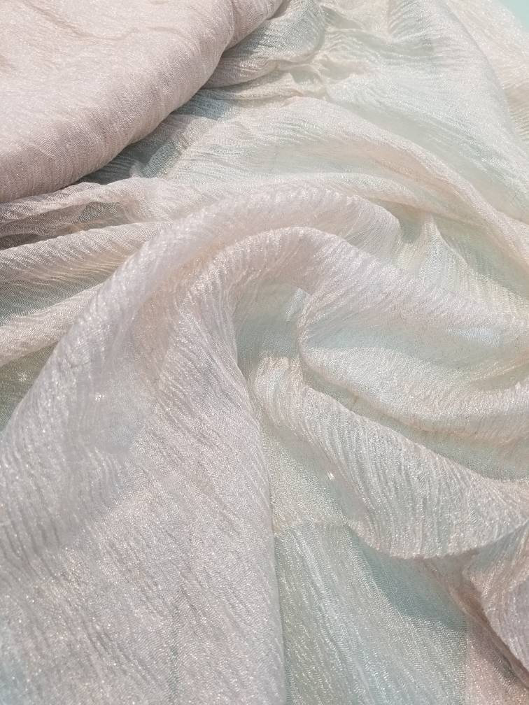 Metallic off white  color krinikled silk organza.  100% Silk Organza. Usable for Apparel and interior designing.