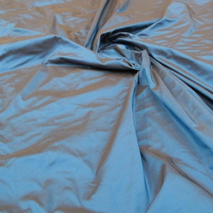 Blue Sapphire Color 100% Silk taffeta is a crisper, finely woven, medium weight silk fabric. 54" Wide Sold by the Yard.