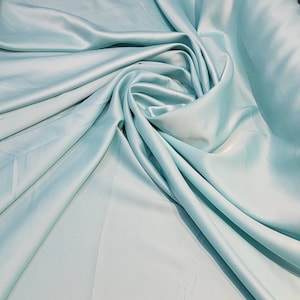Stunning  Italian Aqua Blue  Stretch Satin Elegant and lustrous it is smooth and made of the finest quality 58 inches wide fabric