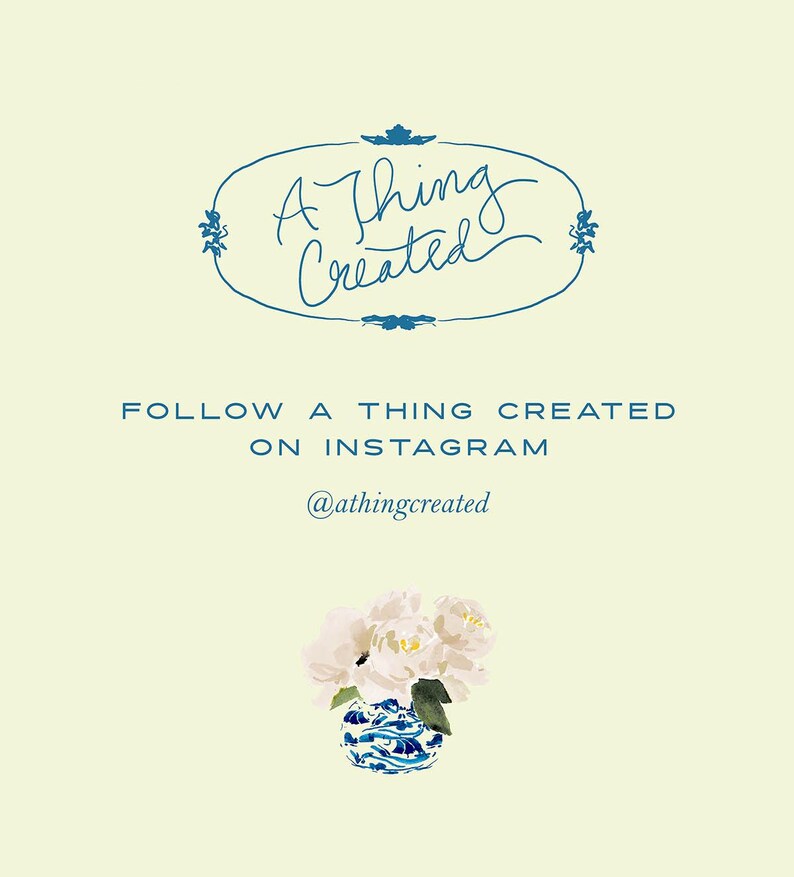 May include: A light yellow background with the text "A Thing Created" in a blue script font, surrounded by a blue oval border. Below, the text reads "Follow A Thing Created on Instagram" and the Instagram handle is @athingcreated. A blue and white vase holds white flowers.