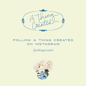 May include: A blue and white porcelain vase with a floral design, filled with white peonies. The text "A Thing Created" is written in a cursive font above the vase. Below the vase, the text "FOLLOW A THING CREATED ON INSTAGRAM @athingcreated" is written in a sans-serif font.