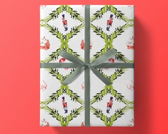 May include: White gift wrap with a repeating pattern of green wreaths, toy soldiers, and gingerbread houses. A gray ribbon is tied in a bow on top.
