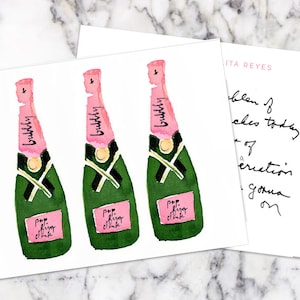 May include: Three watercolor illustrations of pink champagne bottles with green labels that say "bubbly" and "pop fizz clink".