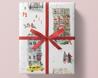 May include: White gift wrap with a red ribbon. The wrap features a repeating pattern of watercolor illustrations of New York City buildings, a yellow taxi, and people walking in the snow.