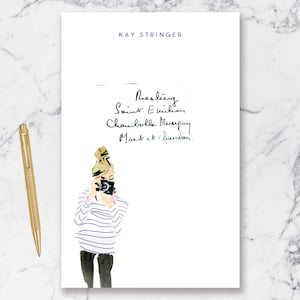 May include: A white card with the text "KAY STRINGER" at the top and handwritten text below: "Pearling, Saint Emilion, Chambolle Musigny, Morey St. Denis."