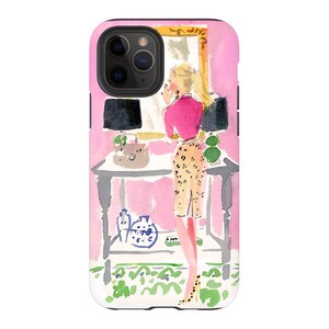 May include: A watercolor illustration of a woman in a pink shirt and leopard print skirt standing in front of a vanity mirror. The woman is looking at her reflection in the mirror. The vanity has a black lamp, a brown purse, and a green plant.