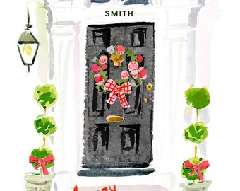 May include: A watercolor painting of a white door with a black door and a wreath with red and white bows. The door has a sign above it that says "SMITH". There are two topiary trees on either side of the door. The text "happy holidays" is written in red below the door.