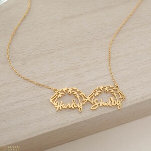 May include: Gold necklace with two names, "Harley" and "Shelby", written in a cursive script.