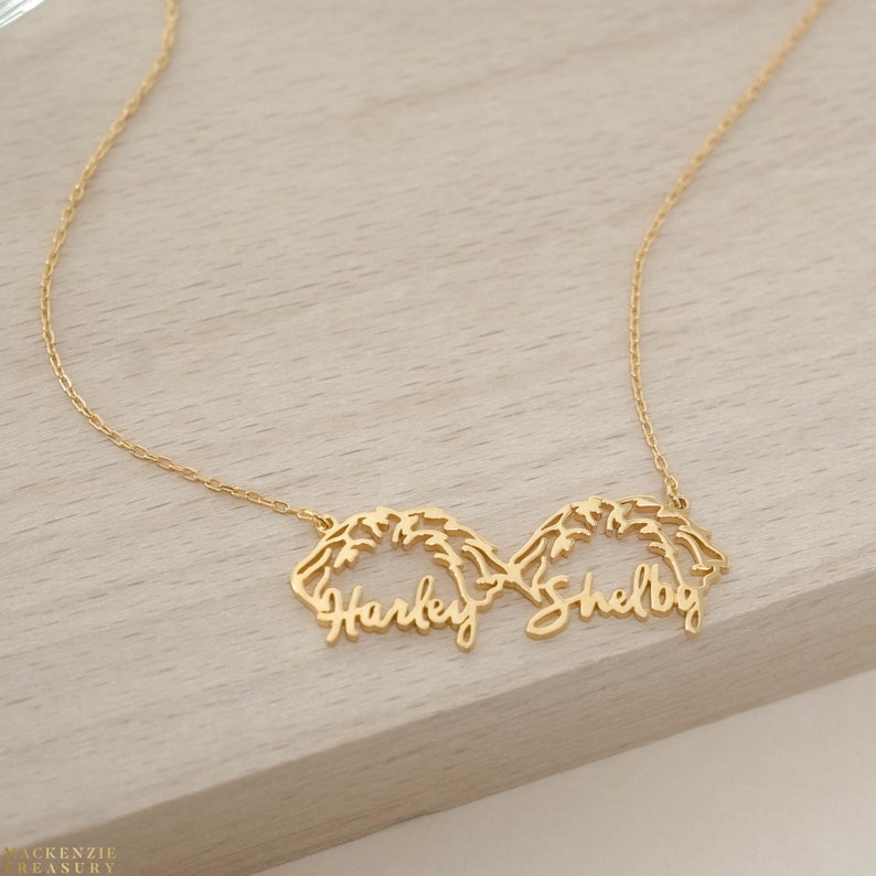 May include: Gold necklace with two names, "Harley" and "Shelby", written in a cursive script.