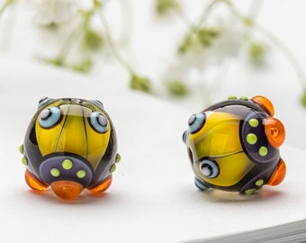 Glass Bead Pair for Jewelry, Yellow, Purple  Lampwork Beads with Orange Burbles and Light Green Dots