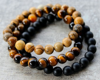Juego de pulseras para hombre de 2, 3 o 4 piezas: jaspe arena y ojo de tigre dorado, con ónix negro o piedra de lava. Regalo para él.
