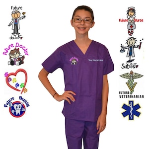 May include: A young person wearing a purple scrub top and matching pants. The scrub top has a pocket with an embroidered image of a doctor holding a stethoscope. The text "Future Doctor" is embroidered on the pocket. The text "Your Name Here" is embroidered on the right side of the scrub top.