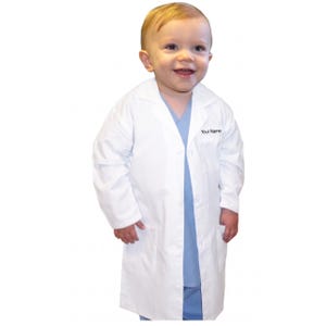May include: A white lab coat for children, featuring a button-down front and pockets. The text "Your Name" is embroidered on the chest. The child is wearing a light blue shirt underneath.
