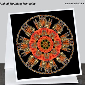 May include: A square card with a mandala design featuring orange and black butterfly wings on a black background. The card measures 5.25 inches by 5.25 inches.