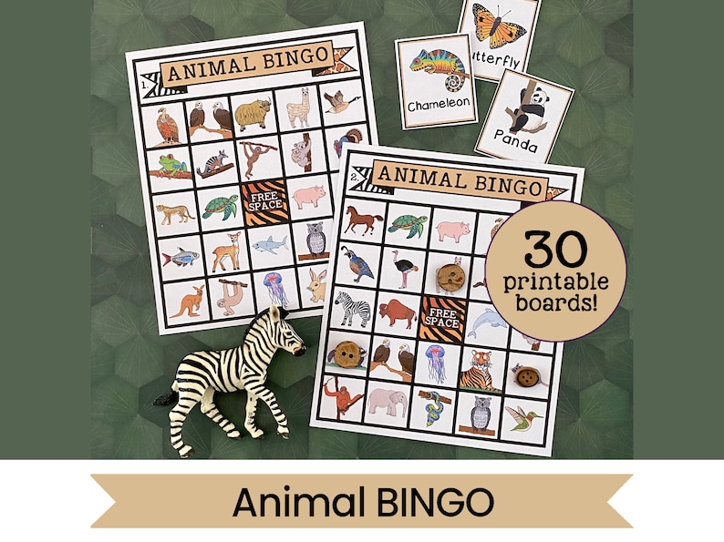 May include: Two printable animal bingo cards with a zebra toy and a button on the table. The cards feature a variety of animals including a panda, a butterfly, a chameleon, an owl, a tiger, a fish, a turtle, a kangaroo, a jellyfish, a monkey, a pig, a horse, an ostrich, a buffalo, a dolphin, an elephant, a snake, a hummingbird, and a  'free space'. The text on the cards reads 'Animal Bingo' and '30 printable boards!'