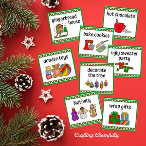 May include: A set of 10 Christmas activity cards with colorful illustrations and text. The cards include activities like baking cookies, decorating the tree, and donating toys. The cards are printed on white cardstock with red and green stripes.