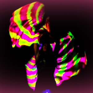 Hand dyed silk spin flags. Extremely UV reflective.  Knock their socks off at your next black light event!  Made To Order