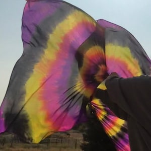 Hand dyed silk spin flags. Extremely UV reflective.  Knock their socks off at your next black light event!  Made To Order