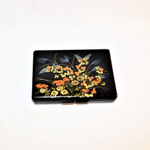 Bloemen compact bakelieten sieradendoosje make-up ringbakje sigarettenhouder Aziatische spiegel kleurrijke bloemen Hongkong zwart eigendom