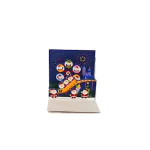 Tarjeta navideña emergente de Sanrio con diseño de Hello Kitty y libro de Papá Noel, saludo festivo japonés