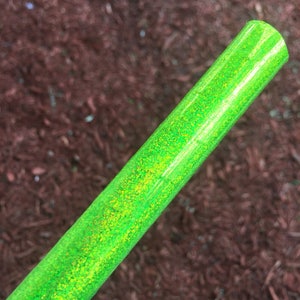 May include: A green iridescent glitter hoop with a shiny finish.