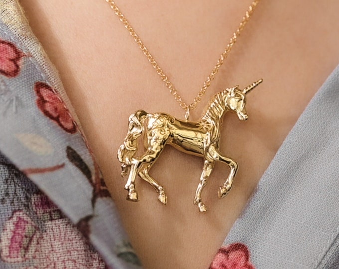 The last unicorn pendant necklace in 14k gold plate with gold fill chain.