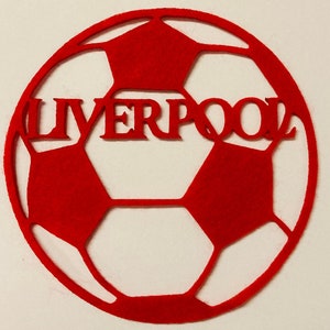 May include: Red felt football with the word "LIVERPOOL" cut out in the centre.