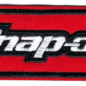 May include: A red rectangular embroidered patch with a black border and the white text "Snap-on" in a stylized font.