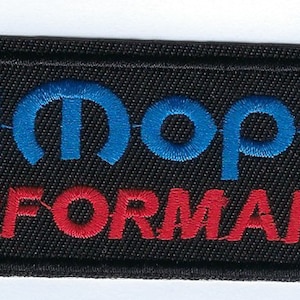 May include: Black embroidered patch with a blue and white Mopar logo and the text "Performance" in red.