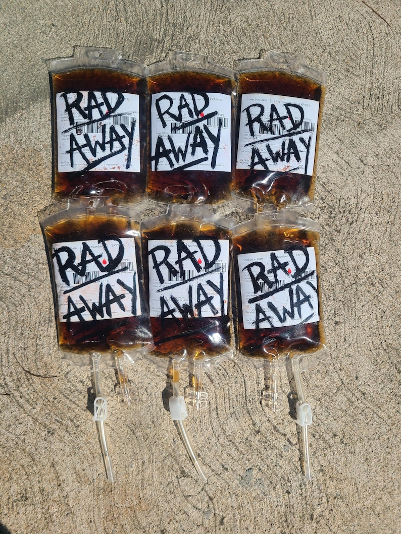 Six Fallout RadAway prop bags displayed in two rows of three on cement, cosplay and display prop packs.
