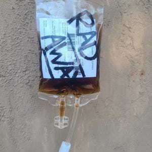 A Fallout prop RadAway bag showing the not weathered version of a label.