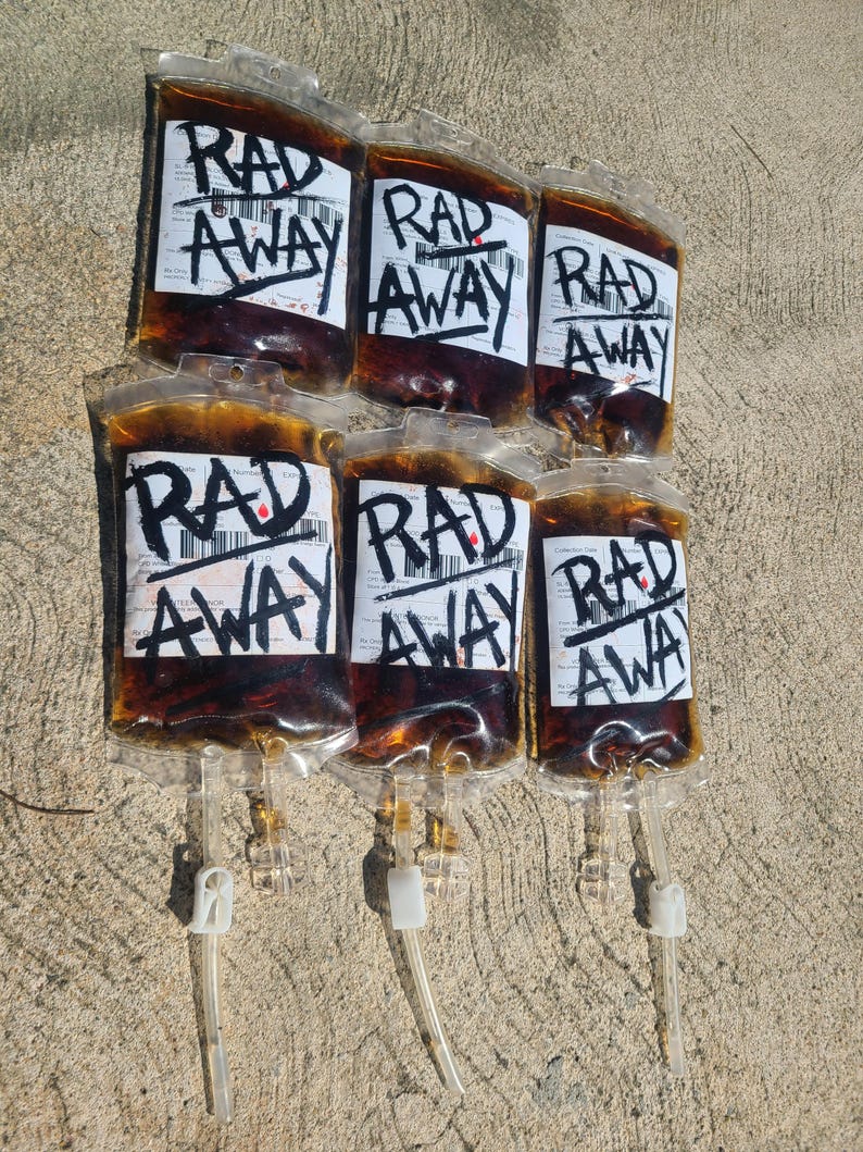 Six Fallout RadAway prop bags displayed in two rows of three on cement, cosplay and display prop packs.