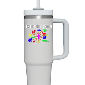 May include: White stainless steel travel mug with a handle and a straw. The mug has a graphic of a food chain with a human at the center and various animals around it. The text "THE FOOD CHAIN" is printed on the mug.