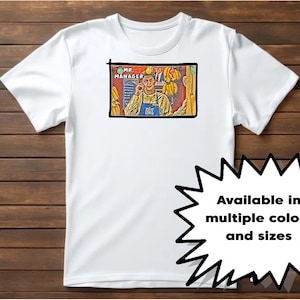 May include: White t-shirt featuring a cartoon image of a man in a yellow apron with the text "MR. MANAGER". The shirt has a black border around the image and the text "Available in multiple colors and sizes" in a starburst.