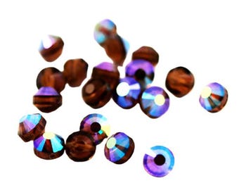Cristales de Swarovski redondos Topacio Ahumado AB Art. 349/5101 - 6 mm (12) - Cuentas Vintage Raras