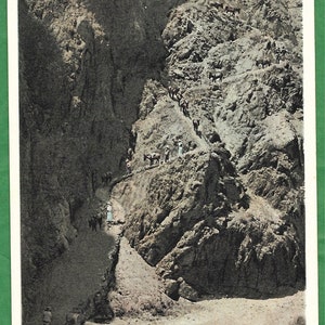 May include: A black and white vintage postcard depicting a steep, winding trail in the Grand Canyon, Arizona. The trail is known as "Devil's Corkscrew on Bright Angel Trail".
