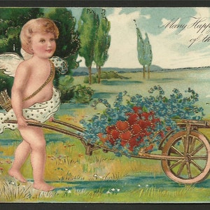 Vintage Embossed   Cupid Pushing a Flower Cart  Many Happy Returns of the Day  Greetings   (1630)