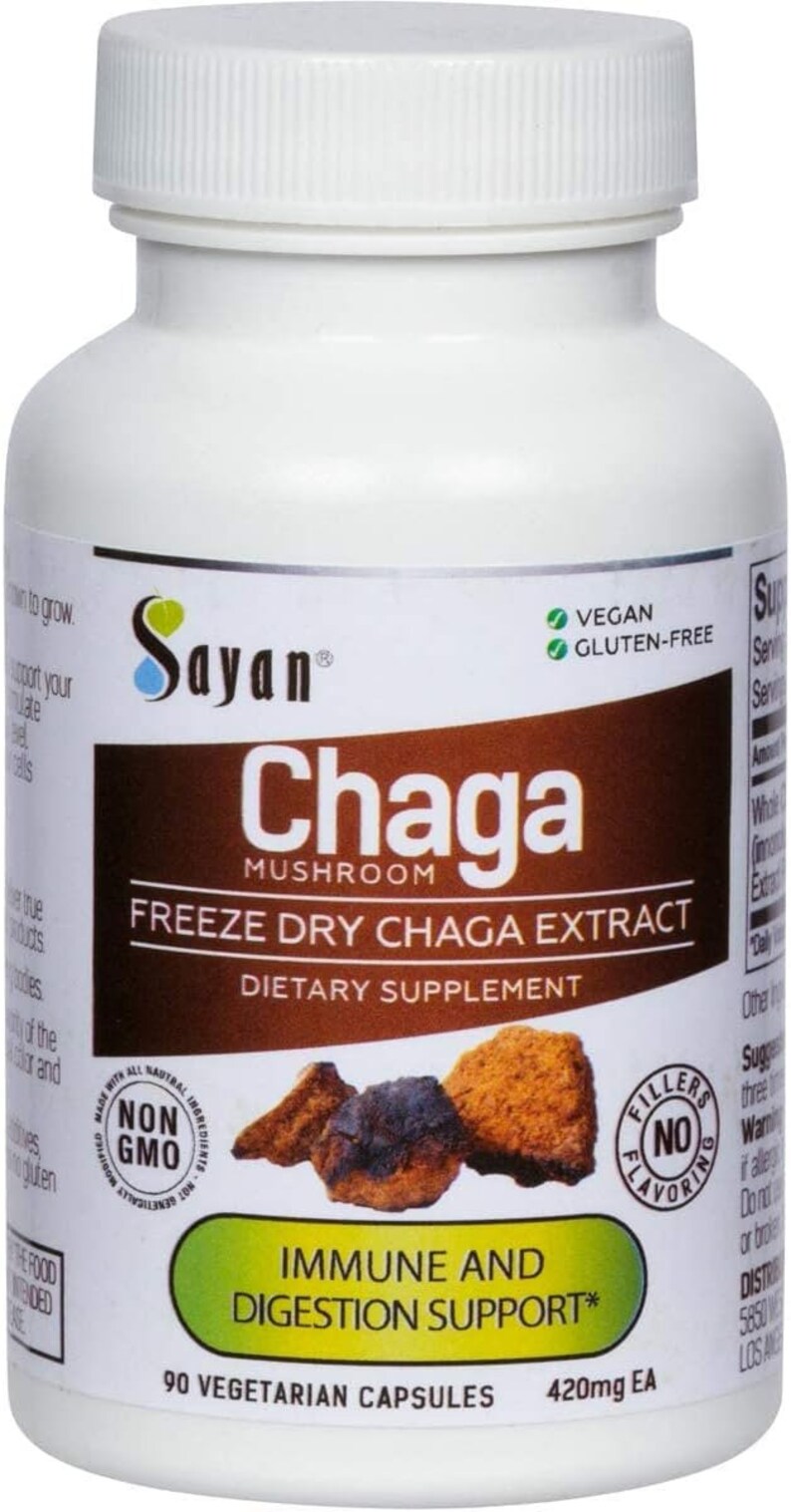 K&ouml;nnte beinhalten: Wei&szlig;e Plastikflasche mit einem gr&uuml;nen Etikett, auf dem "Sayan Chaga Mushroom Freeze Dry Chaga Extract Dietary Supplement" steht. Das Etikett tr&auml;gt au&szlig;erdem die Aufschrift "Vegan Glutenfrei" und "Immun- und Verdauungsunterst&uuml;tzung*" mit einem Bild eines Pilzes. Die Flasche enth&auml;lt 90 vegetarische Kapseln &agrave; 420 mg.