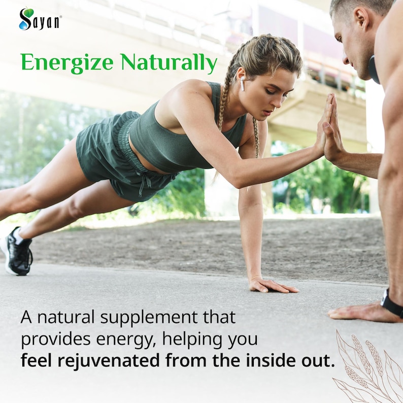 May include: Two people doing a plank exercise outdoors. The text "Sayan Energize Naturally" is at the top of the image. The text "A natural supplement that provides energy, helping you feel rejuvenated from the inside out." is at the bottom of the image.
