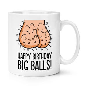 May include: White ceramic mug with a humorous illustration of testicles and the text "HAPPY BIRTHDAY BIG BALLS!" in black. The mug has a curved handle and is suitable for hot or cold beverages.