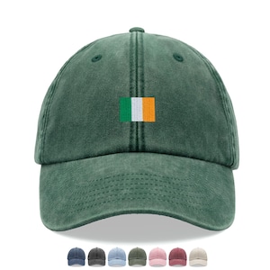 May include: A forest green baseball cap with a structured crown and a curved brim. Centered on the front panel is an embroidered rectangular patch featuring the green, white, and orange vertical tricolour flag of Ireland in a clean, stitched design.