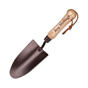 May include: A small, brown gardening hand trowel with a wooden handle. The handle is engraved with the text "Any Message".