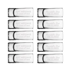 May include: A collection of ten clear glass USB flash drives. Five drives are engraved with "ANY MESSAGE 2 Lines of text". The other five are engraved with "Kendall's 21st 08.12.2022". The drives have a rectangular shape with rounded edges.