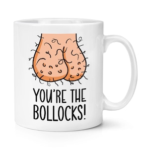 May include: White ceramic mug with a humorous illustration of testicles and the phrase "YOU'RE THE BOLLOCKS!" in black text. The mug has a curved handle and is suitable for hot or cold beverages.