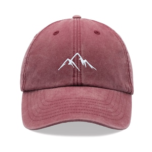 May include: A burgundy cotton baseball cap with a white embroidered mountain design.