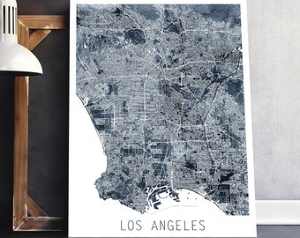 May include: A black and white map of Los Angeles, California. The map is printed on a white background and has a blue watercolor effect.