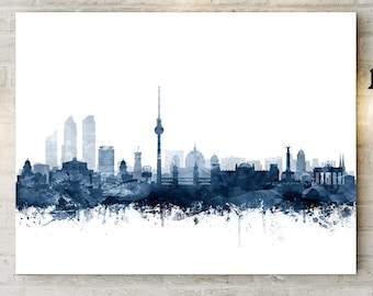 May include: A watercolor painting of the Berlin skyline in shades of blue. The cityscape includes the Brandenburg Gate, the Berlin TV Tower, and other iconic landmarks.